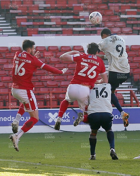 090121 - Nottingham Forest v Cardiff City - FA Cup Third Round - Robert Glatzel of Cardiff tries to head ball into the net but is blocked by Scott McKenna of Nottingham Forest