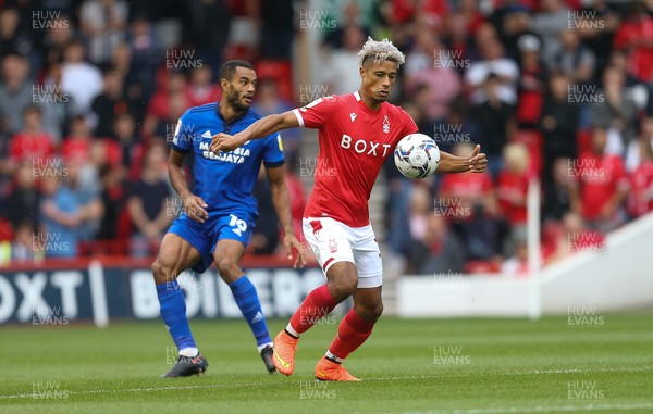 120921 - Nottingham Forest v Cardiff City, Sky Bet Championship - Lyle Taylor of Nottingham Forest and James Collins of Cardiff City compete for the ball
