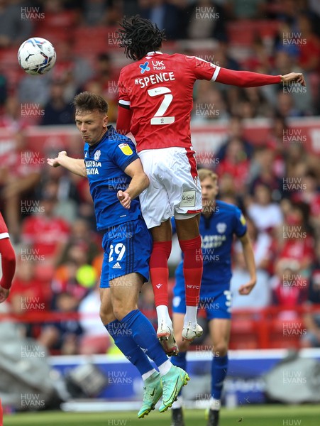 120921 - Nottingham Forest v Cardiff City, Sky Bet Championship - Mark Harris of Cardiff City is beaten to the ball by Djed Spence of Nottingham Forest