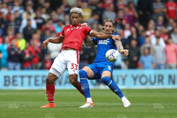 120921 - Nottingham Forest v Cardiff City, Sky Bet Championship - Lyle Taylor of Nottingham Forest and Aden Flint of Cardiff City compete for the ball