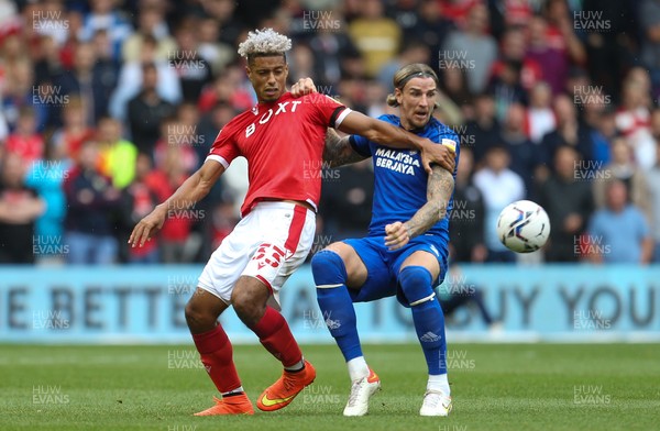 120921 - Nottingham Forest v Cardiff City, Sky Bet Championship - Lyle Taylor of Nottingham Forest and Aden Flint of Cardiff City compete for the ball