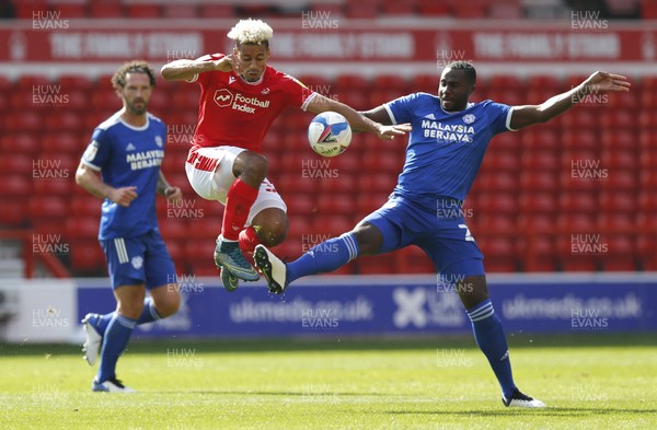 190920 - Nottingham Forest v Cardiff City - Sky Bet Championship - Sol Bamba of Cardiff and Lyle Taylor of Nottingham Forest