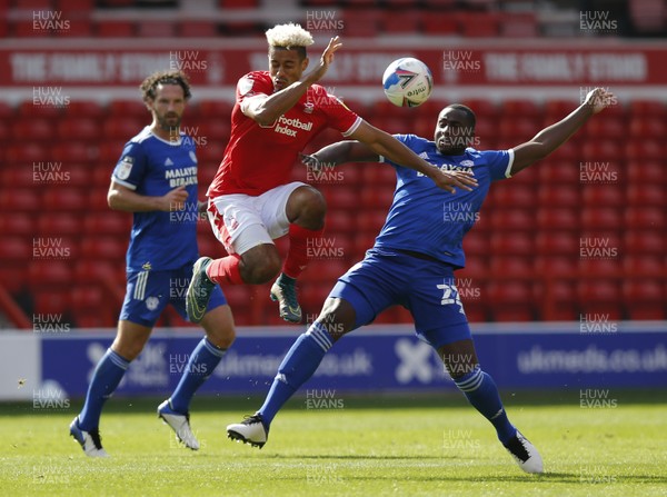 190920 - Nottingham Forest v Cardiff City - Sky Bet Championship - Sol Bamba of Cardiff and Lyle Taylor of Nottingham Forest