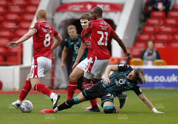 150720 - Nottingham Forest v Swansea - Sky Bet Championship - Conor Gallagher of Swansea tries to claim the ball from Ben Watson of Nottingham Forest