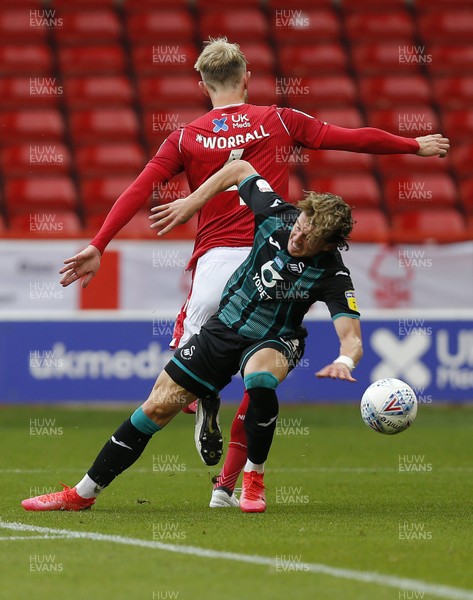 150720 - Nottingham Forest v Swansea - Sky Bet Championship - Conor Gallagher of Swansea tangles with Joe Worrall of Nottingham Forest