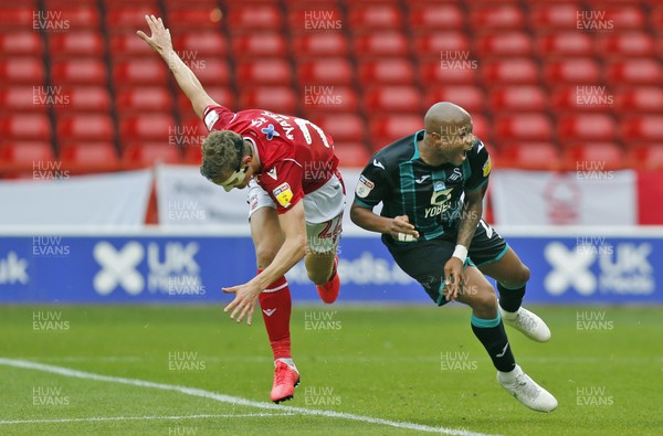150720 - Nottingham Forest v Swansea - Sky Bet Championship - Andre Ayew of Swansea goes down in the box by Ryan Yates of Nottingham Forest for a penalty