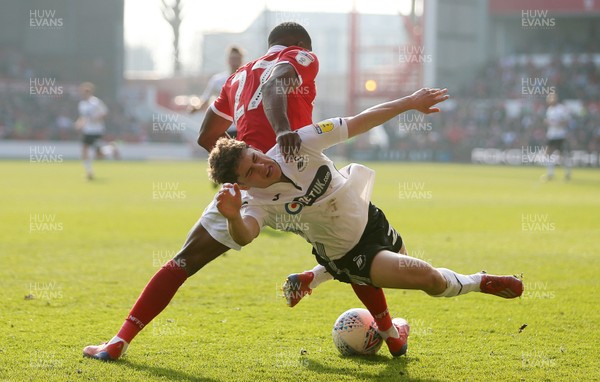 300319 - Nottingham Forest v Swansea City - SkyBet Championship - Daniel James of Swansea City is tackled by Tendayi Darikwa of Nottingham Forest