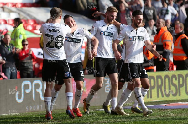 300319 - Nottingham Forest v Swansea City - SkyBet Championship - Oli McBurnie celebrates with team mates after scoring a goal off the shot of George Byers of Swansea City