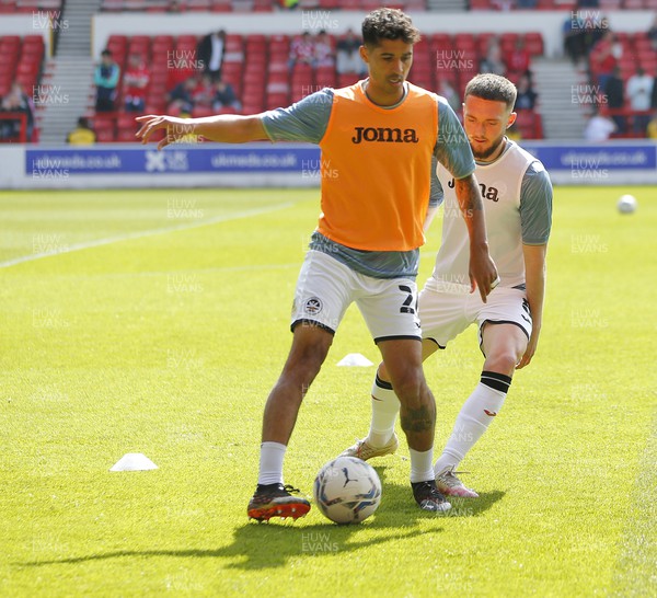 300422 - Nottingham Forest v Swansea - Sky Bet Championship - Matt Grimes of Swansea  and Kyle Naughton of Swansea warm up before the match