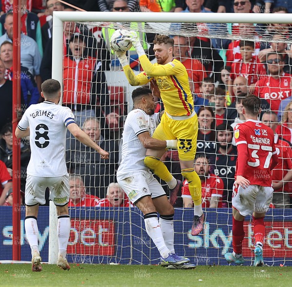300422 - Nottingham Forest v Swansea City - Sky Bet Championship - Goalkeeper Andy Fisher of Swansea saves in the 2nd half from James Garner of Nottingham Forest