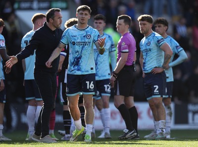 060426 - Notts County v Newport County - Sky Bet League 2 - Team mates and Referee look on as Newport manager Christian Fuchs and James Crole of Newport argue at the end of the match