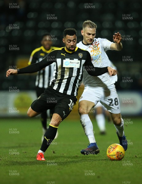 190219 - Notts County v Newport County, Sky Bet League 2 - Mickey Demetriou of Newport County is challenged by Kane Hemmings of Notts County