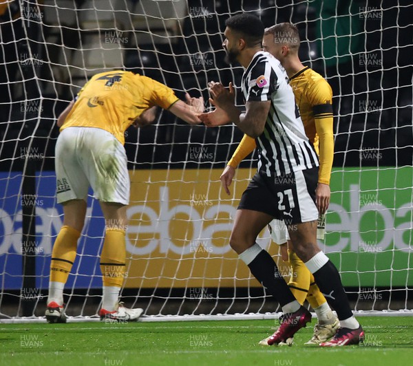 241023 - Notts County v Newport County - Sky Bet League 2 - Ryan Delaney of Newport County clings to the net after Connell Rawlinson of Notts County scores 3rd goal
