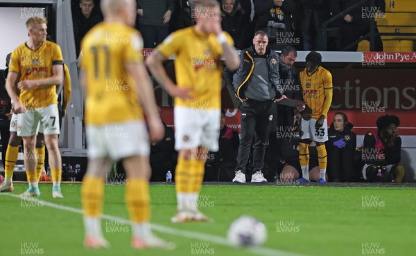 241023 - Notts County v Newport County - Sky Bet League 2 - Manager Graham Coughlan of Newport County looks dejected as players prepare to start the game at 3-0 down