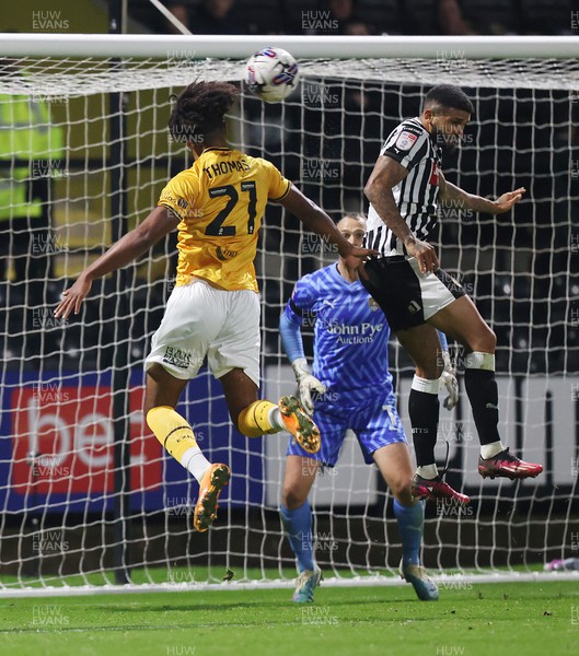 241023 - Notts County v Newport County - Sky Bet League 2 - Olly Thomas of Newport County tries a header on goal but is blocked by Tobi Adebayo-Rowling of Notts County