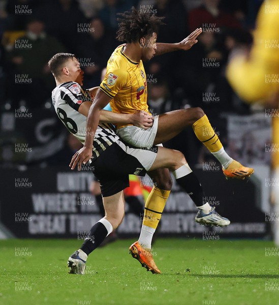 241023 - Notts County v Newport County - Sky Bet League 2 - Lewis Macari of Notts County lifts Olly Thomas of Newport County off the ball