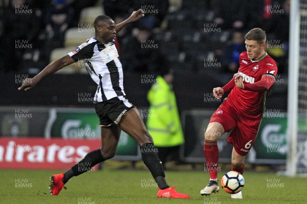 270118 - Notts County v Swansea City, FA Cup Fourth Round - Alfie Mawson of Swansea City (right) in action with  Shola Ameobi of Notts County
