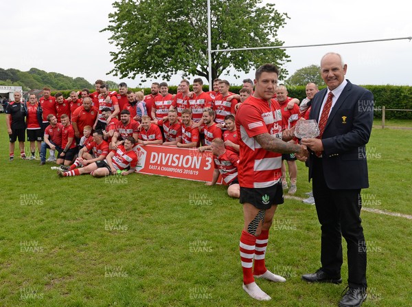180519 - Oakdale v Abertysswg Falcons - WRU National League 3 East A -  Oakdale captain Keir Ennis receives the trophy from Rob Butcher of the WRU