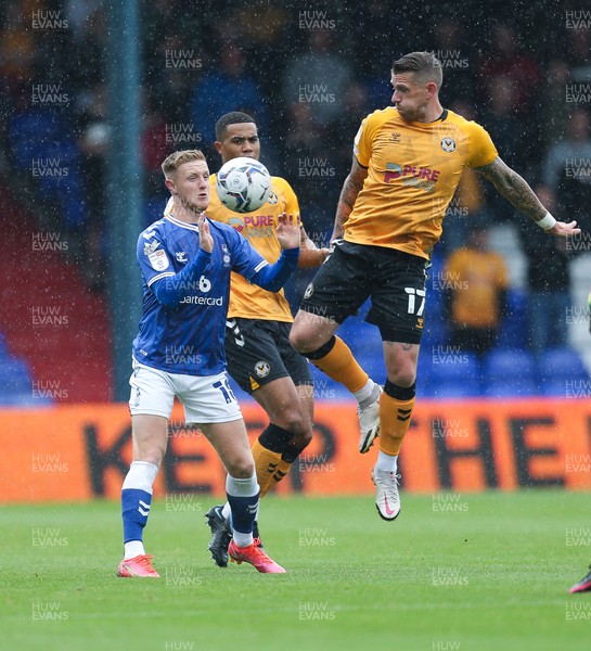 070821 - Oldham Athletic v Newport County, EFL Sky Bet League 2 - Scot Bennett of Newport County and Davis Keillor-Dunn of Oldham Athletic compete for the ball