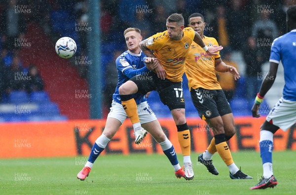 070821 - Oldham Athletic v Newport County, EFL Sky Bet League 2 - Scot Bennett of Newport County and Davis Keillor-Dunn of Oldham Athletic compete for the ball