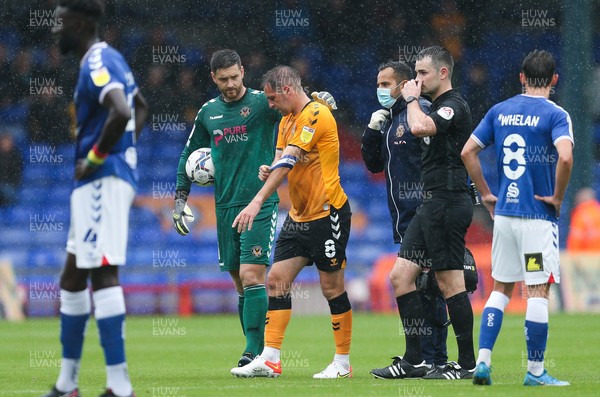 070821 - Oldham Athletic v Newport County, EFL Sky Bet League 2 - Matty Dolan of Newport County leaves the pitch with an injury