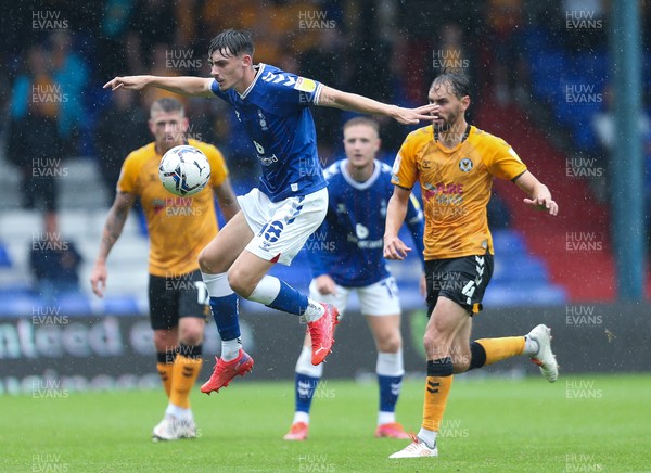 070821 - Oldham Athletic v Newport County, EFL Sky Bet League 2 - Jamie Bowden of Oldham Athletic controls the ball as Ed Upson of Newport County closes in