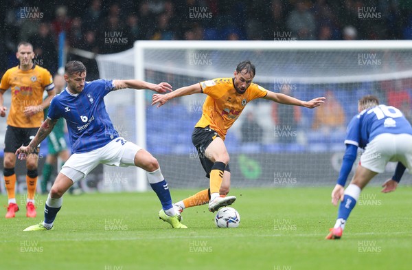 070821 - Oldham Athletic v Newport County, EFL Sky Bet League 2 - Ed Upson of Newport County takes on Jacob Blyth of Oldham Athletic and Davis Keillor-Dunn of Oldham Athletic