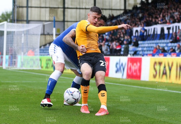 070821 - Oldham Athletic v Newport County, EFL Sky Bet League 2 - Lewis Collins of Newport County and Alan Sheehan of Oldham Athletic compete for the ball