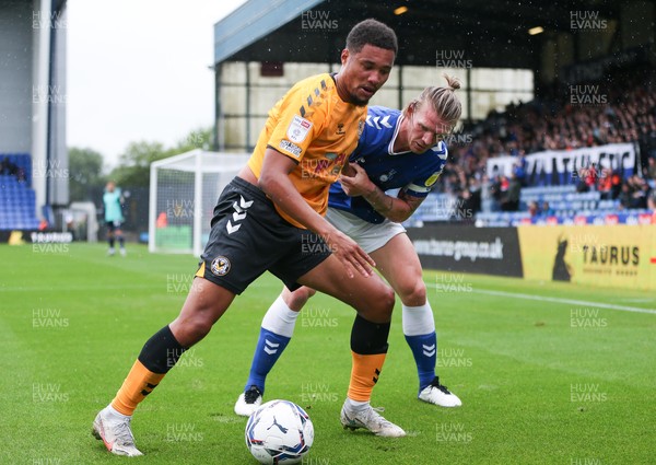 070821 - Oldham Athletic v Newport County, EFL Sky Bet League 2 - Jermaine Hylton of Newport County and Carl Piergianni of Oldham Athletic compete for the ball