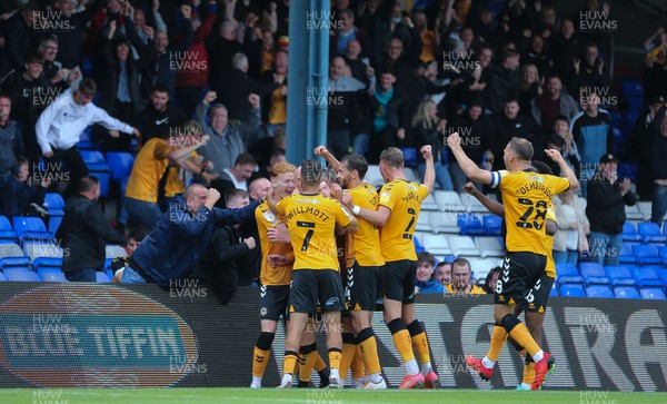 070821 - Oldham Athletic v Newport County, EFL Sky Bet League 2 - Kevin Ellison of Newport County is mobbed by team mates and fans as he celebrates after scoring goal