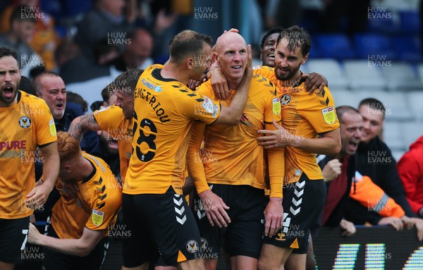 070821 - Oldham Athletic v Newport County, EFL Sky Bet League 2 - Kevin Ellison of Newport County is congratulated by Mickey Demetriou of Newport County and Ed Upson of Newport County after scoring goal