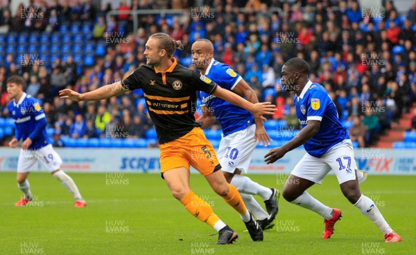 080918 - Oldham Athletic v Newport County - Sky Bet League 2 - Newport County defender Fraser Franks (5) chases the ball under pressure from Oldham Athletic midfielder Christopher Missilou (17)