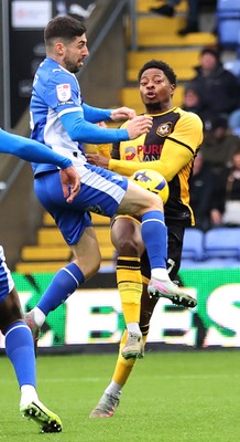 221125 - Oldham Athletic v Newport County - Sky Bet League 2 - Bobby Kamwa of Newport tries a shot on goal Also pictured, Tom Pete of Oldham