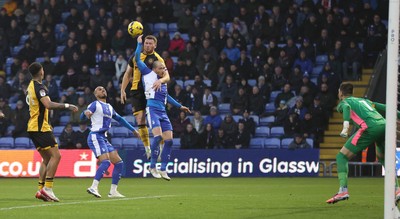 221125 - Oldham Athletic v Newport County - Sky Bet League 2 - Lee Jenkins of Newport header on goal above Jake Caprice of Oldham saved by Goalkeeper Mathew Hudsoc of Oldham