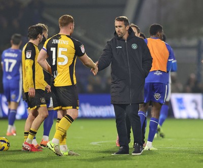 221125 - Oldham Athletic v Newport County - Sky Bet League 2 - Newport Manager Christian Fuchs and Lee Jenkins of Newport at the end of the match