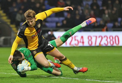 221125 - Oldham Athletic v Newport County - Sky Bet League 2 - Goalkeeper Mathew Hudsoc of Oldham fumbles the ball from incoming corner but charges into Ged Garner of Newport