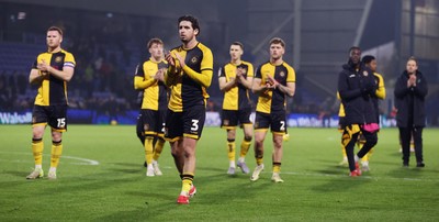 221125 - Oldham Athletic v Newport County - Sky Bet League 2 - Newport team applaud the travelling fans at the end of the match