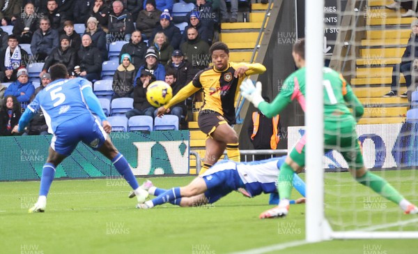 221125 - Oldham Athletic v Newport County - Sky Bet League 2 - Bobby Kamwa of Newport tries a shot on goal Saved by Goalkeeper Mathew Hudsoc of Oldham