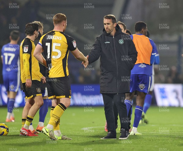 221125 - Oldham Athletic v Newport County - Sky Bet League 2 - Newport Manager Christian Fuchs and Lee Jenkins of Newport at the end of the match