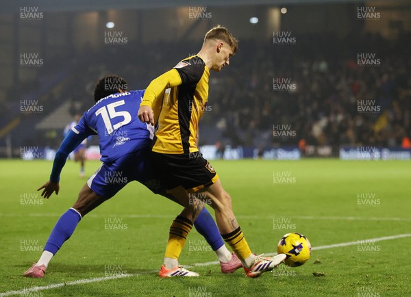 221125 - Oldham Athletic v Newport County - Sky Bet League 2 - Kai Whitmore of Newport is challenged by Kane Drummond of Oldham