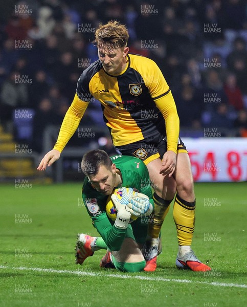 221125 - Oldham Athletic v Newport County - Sky Bet League 2 - Goalkeeper Mathew Hudsoc of Oldham fumbles the ball from incoming corner but charges into Ged Garner of Newport