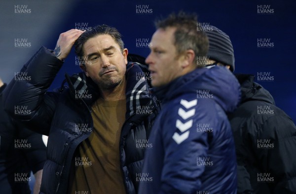 230121 - Oldham Athletic v Newport County - Sky Bet League 2 - Manager Mike Flynn of Newport County and Manager Harry Kewell of Oldham Athletic at the end of the match