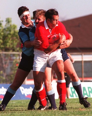 15.07.97 Wales Tour to America and Canada... Ontario v Wales. Chris Wyatt is held by Peter Ross(headband) and David Swindells at Mohawk Sports Park, Hamilton. 
