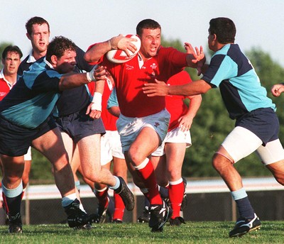 15.07.97 Wales Tour to America and Canada... Ontario v Wales. Matthew Back hands off Joe Pagano(rt) and Jonathan Ashley at Mohawk Sports Park, Hamilton. 