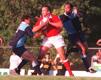 15.07.97 Wales Tour to America and Canada... Ontario v Wales. Rob Appleyard is tackled by Kyle Nicholls(lt) and Jason Hall at Mohawk Sports Park, Hamilton. 