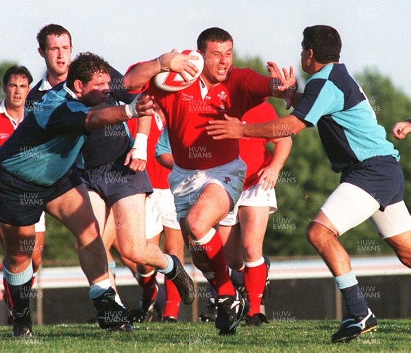 15.07.97 Wales Tour to America and Canada... Ontario v Wales. Matthew Back hands off Joe Pagano(rt) and Jonathan Ashley at Mohawk Sports Park, Hamilton. 
