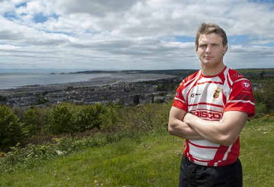 220513 - Ospreys - Pictured with Swansea Bay in the background is Dan Biggar in Gorseinon RFC kit