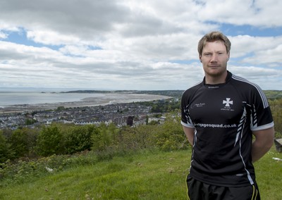 220513 - Ospreys - Pictured with Swansea Bay in the background is Jonathan Spratt in Neath Athletic RFC kit