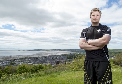 220513 - Ospreys - Pictured with Swansea Bay in the background is Jonathan Spratt in Neath Athletic RFC kit