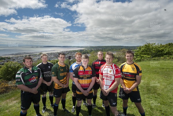 220513 - Ospreys - Pictured with Swansea Bay in the background are Opsreys players LtR: Ryan Bevington in Porthcawl kit, Jonathan Spratt in Neath Athletic kit, Scott Baldwin in Bridgend Athletic kit, Dan Baker in Astradgynlais kit, Dafydd Howells in Abercrave kit, James King in Mold kit, Dan Biggar in Gorseinon kit and Ashley Beck in Skewen kit